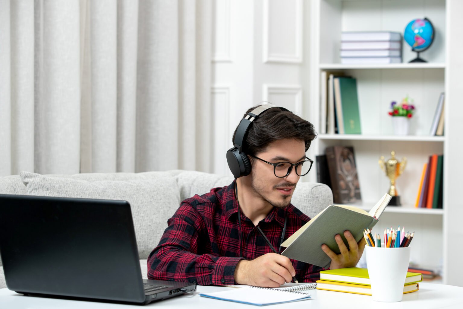 student-online-cute-guy-checked-shirt-with-glasses-studying-computer-reading-book